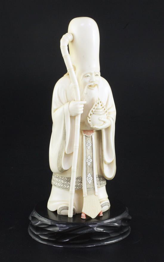 A Japanese ivory figure of Fukurokuju, early 20th century, 20cm, wood stand